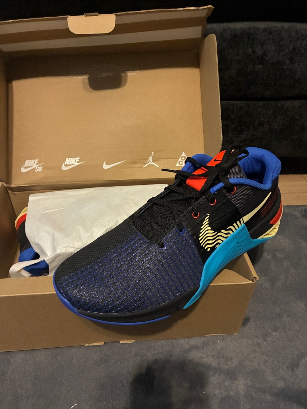 Nike Men’s Black & Blue Athletic Basketball Shoes with Red and Gold Accents